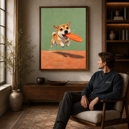Walnut framed flying disc puppy artwork above a seated man in a wood furnished living room.