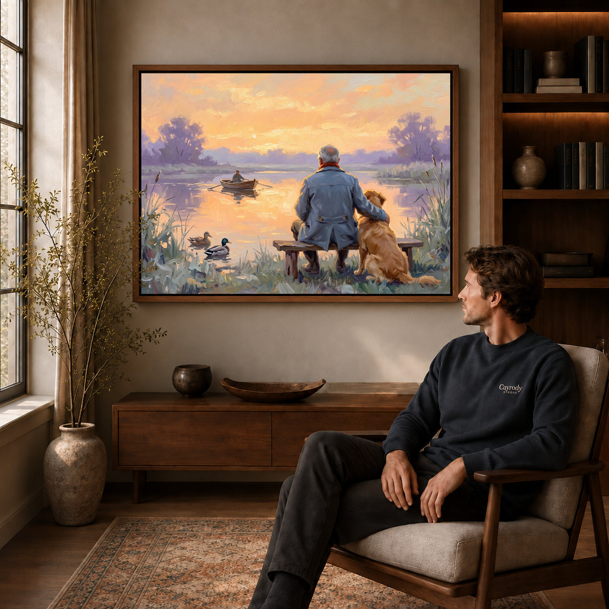 Walnut framed lakeside old friends artwork above a seated man in a wood furnished living room.