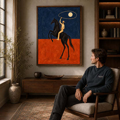 Walnut framed moon lasso rider artwork above a seated man in a wood furnished living room.