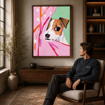 Walnut framed pink curtain puppy artwork above a seated man in a wood furnished living room.