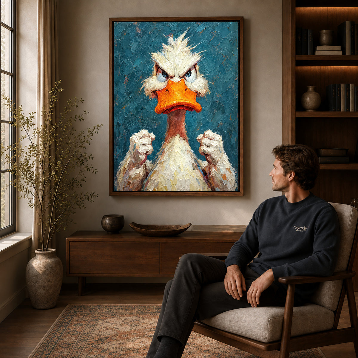 Walnut framed feisty duck portrait artwork above a seated man in a wood furnished living room.