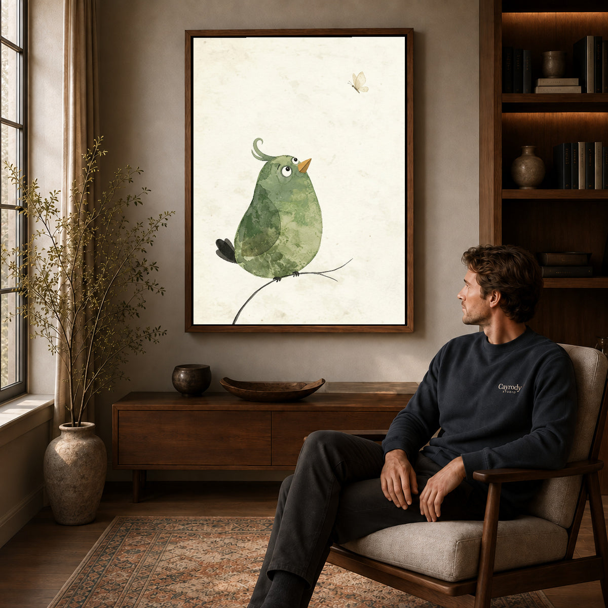 Walnut framed butterfly watching bird artwork above a seated man in a wood furnished living room.