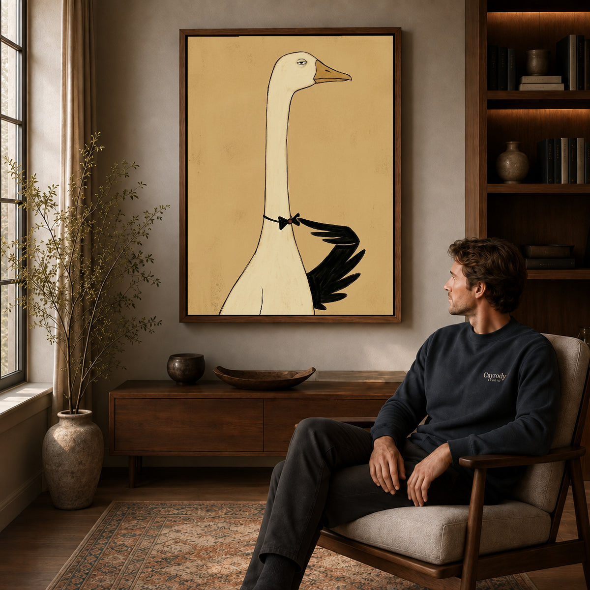 Walnut framed elegant bowtie goose artwork above a seated man in a wood furnished living room.