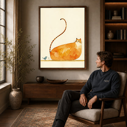 Walnut framed long tailed cat artwork above a seated man in a wood furnished living room.
