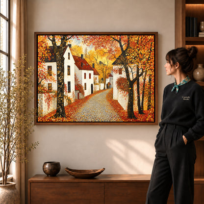 Golden Village Lane artwork in a walnut frame beside a standing woman in a warm room.