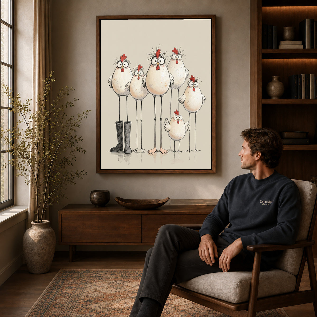 Walnut framed quirky chicken family artwork above a seated man in a wood furnished living room.