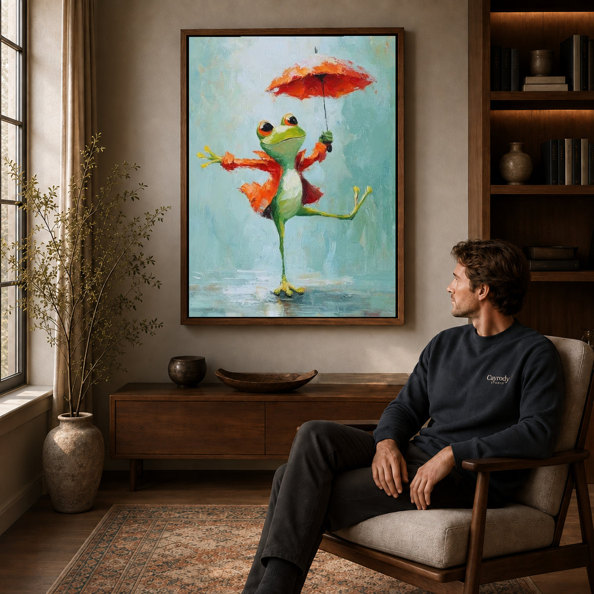 Walnut framed umbrella dancing frog artwork above a seated man in a wood furnished living room.