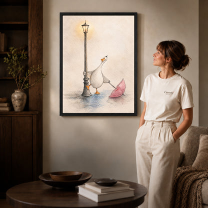 Black framed rainy lamppost goose artwork beside a woman in a warm neutral living room.