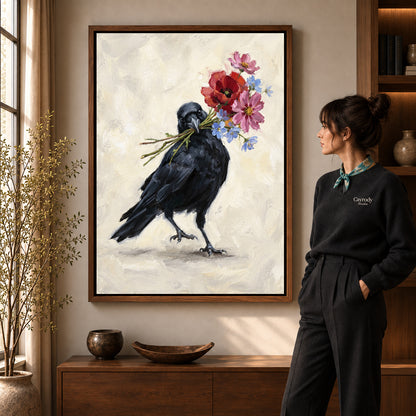 Flower Carrying Crow artwork in a walnut frame beside a standing woman in a warm room.
