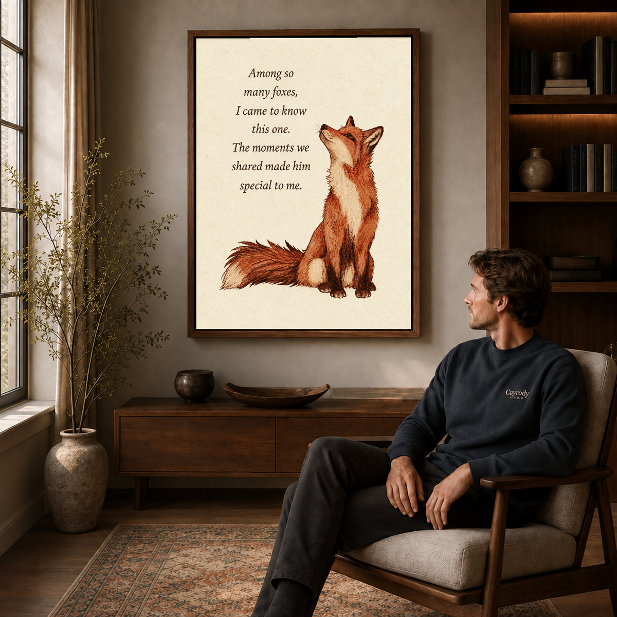 Walnut framed special fox friendship artwork above a seated man in a wood furnished living room.