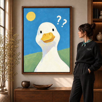Whimsical duck canvas wall art in a walnut frame above a wooden console beside a sunny window.
