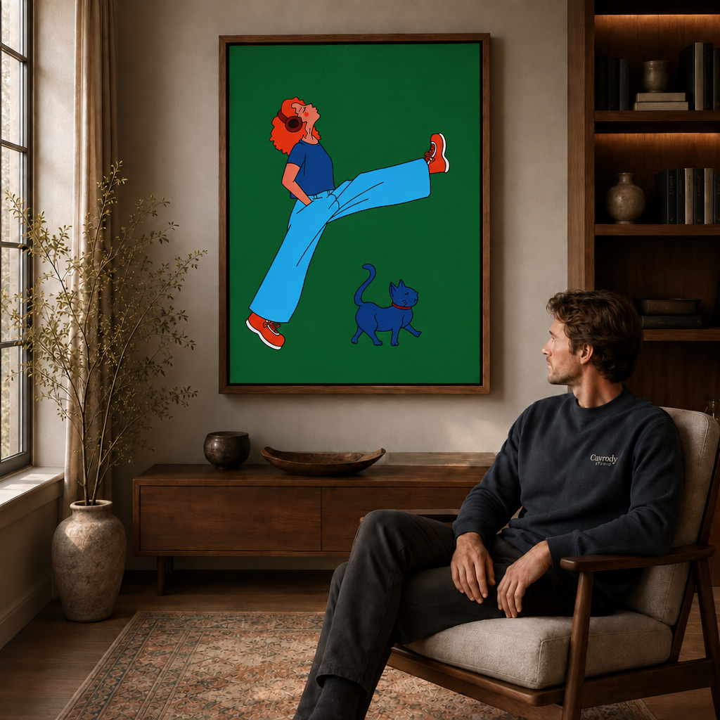 Man seated in a mid-century armchair viewing a framed headphones girl canvas wall art with her blue cat.