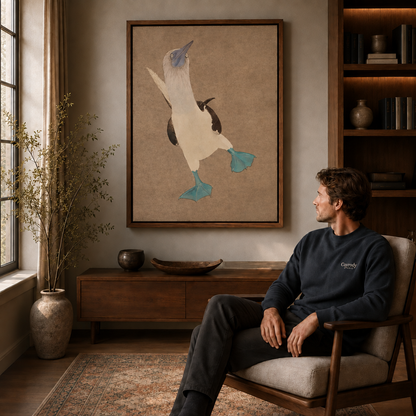 a framed blue-footed booby canvas wall art in a warm living room.