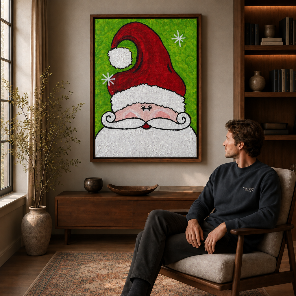 A seated man views the Santa portrait in a walnut frame, showing the red hat and green snowflake artwork.