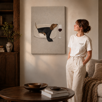 Black-framed cat tea party wall art above a coffee table in a warm living room.