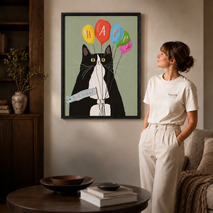 Black-framed canvas shows a tuxedo cat holding birthday balloons.