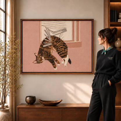  a walnut framed print of a calico cat leaping through a window on a pink background