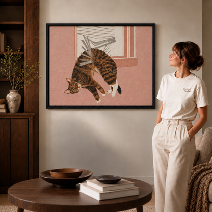 a black framed print of a calico cat leaping headfirst through a window