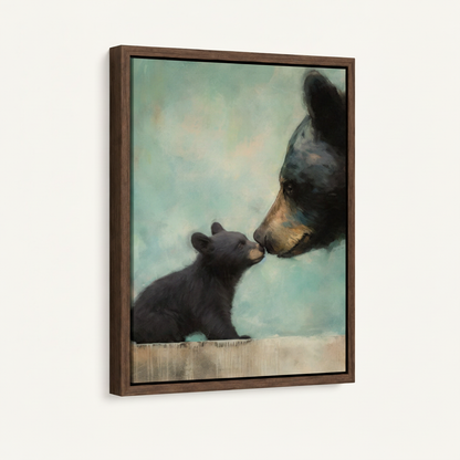 Framed canvas side angle showing black bear mother nuzzling cub on soft teal background in walnut float frame